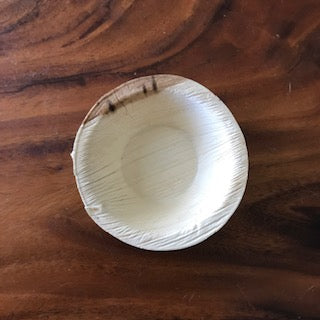 four inch round bowl made from palm leaf